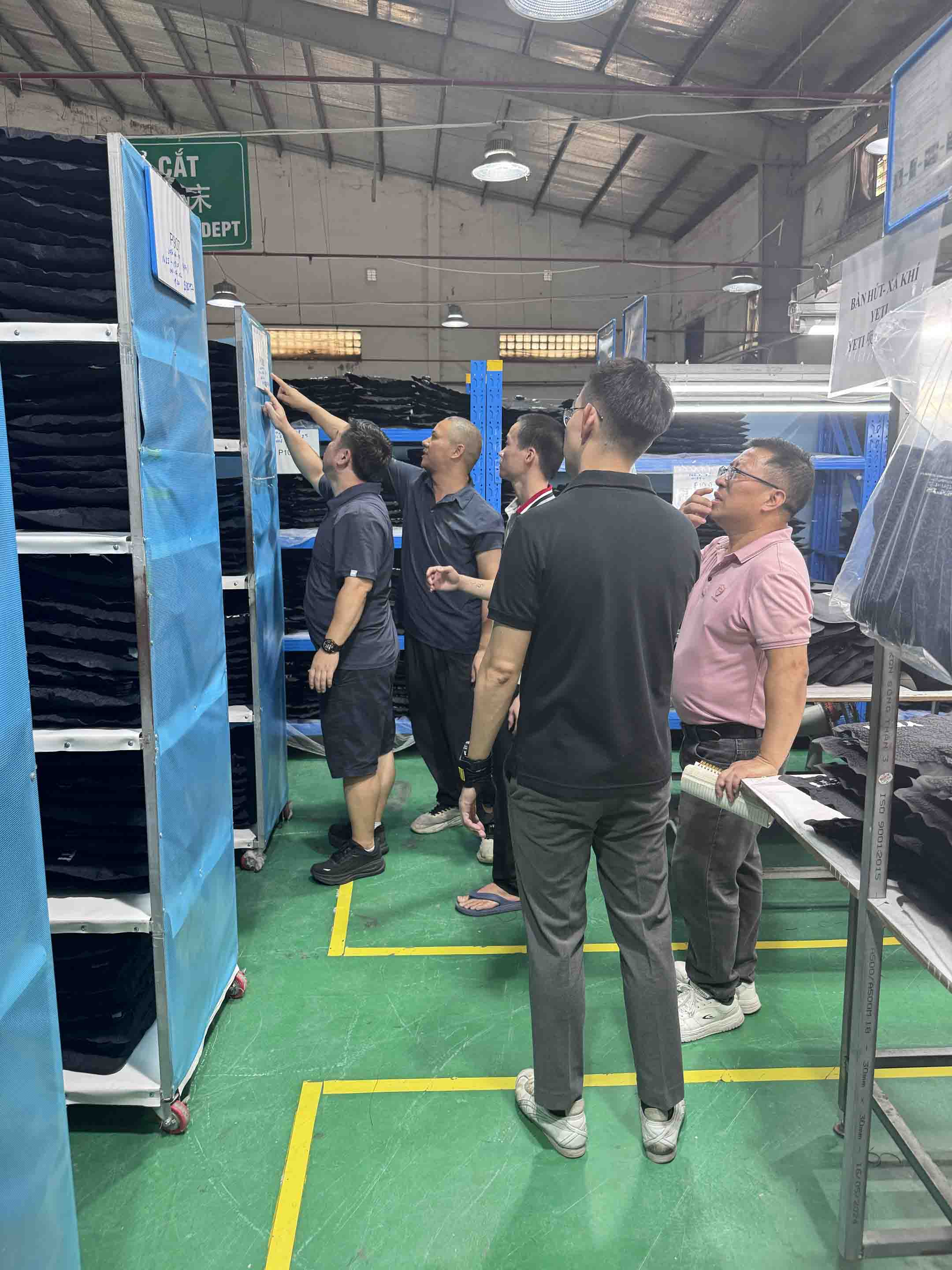 YETI and Sealock teams checking fabric material and cut panels on the production floor