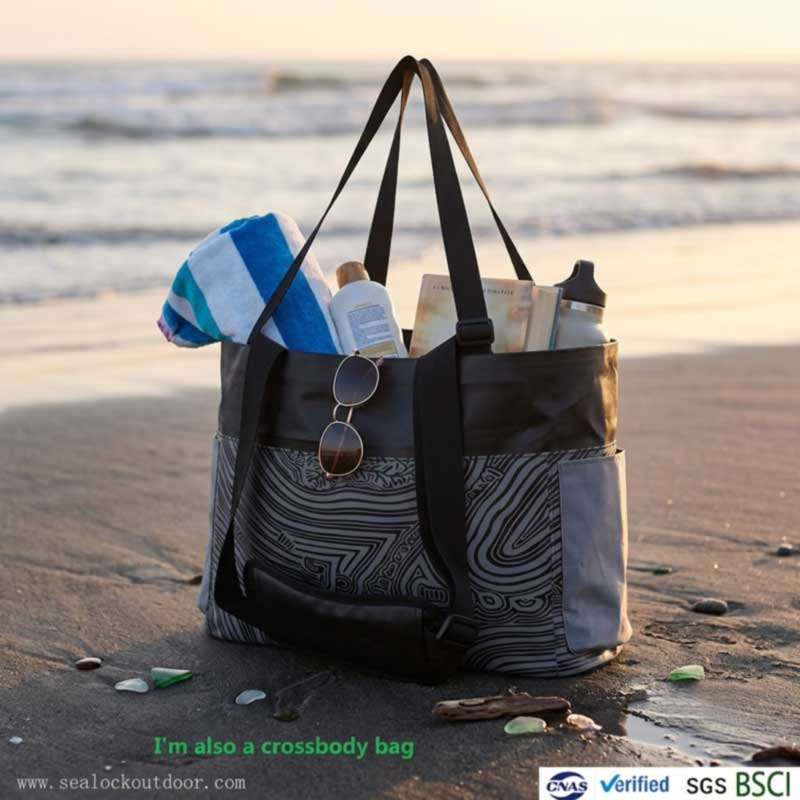 Private label waterproof beach tote standing upright on wet sand loaded with beach essentials
